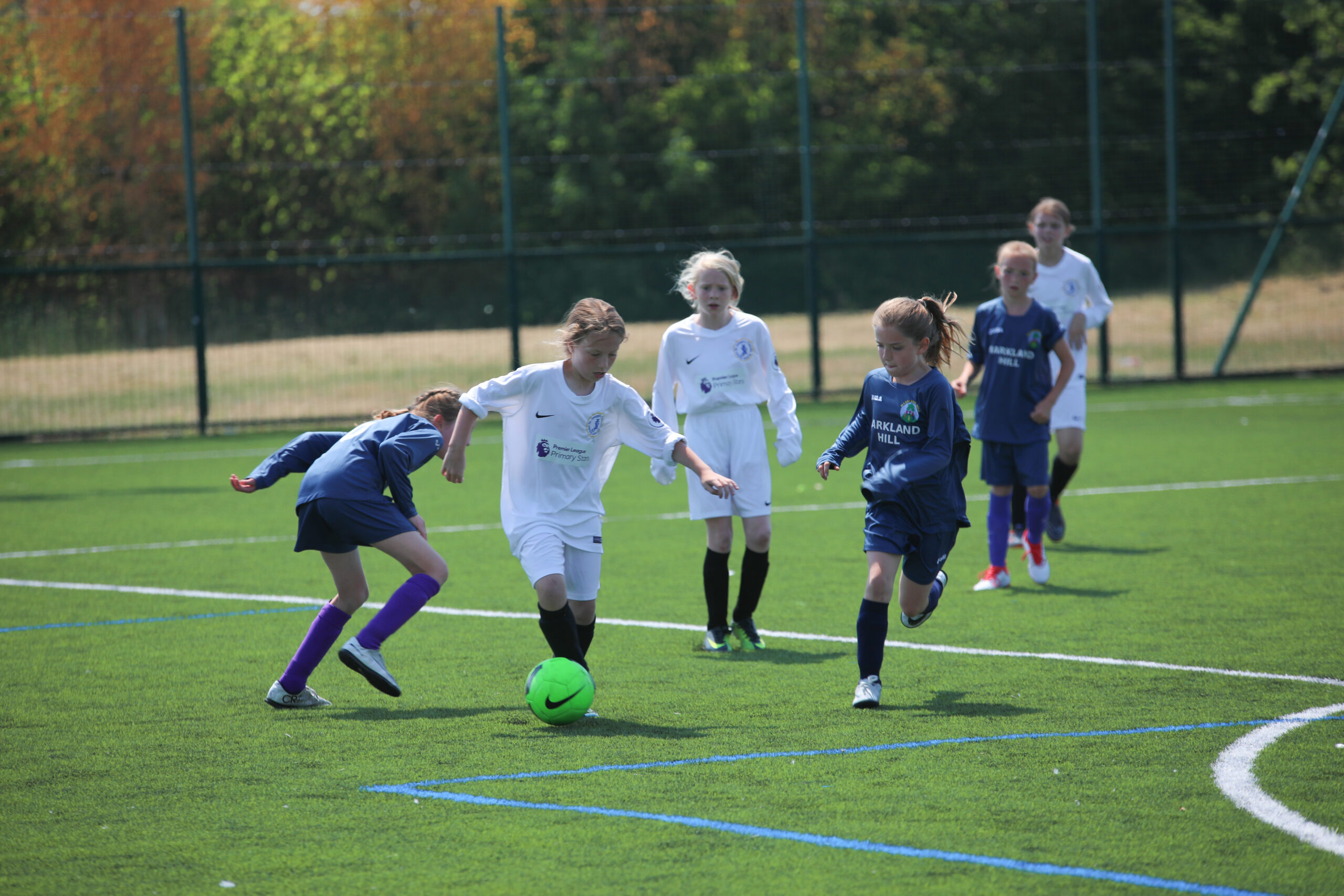 young girls participating in football match