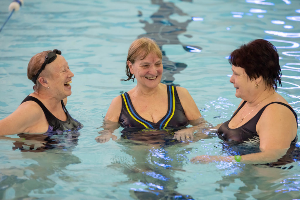 three women swimming in pool at OCL centre in Odham